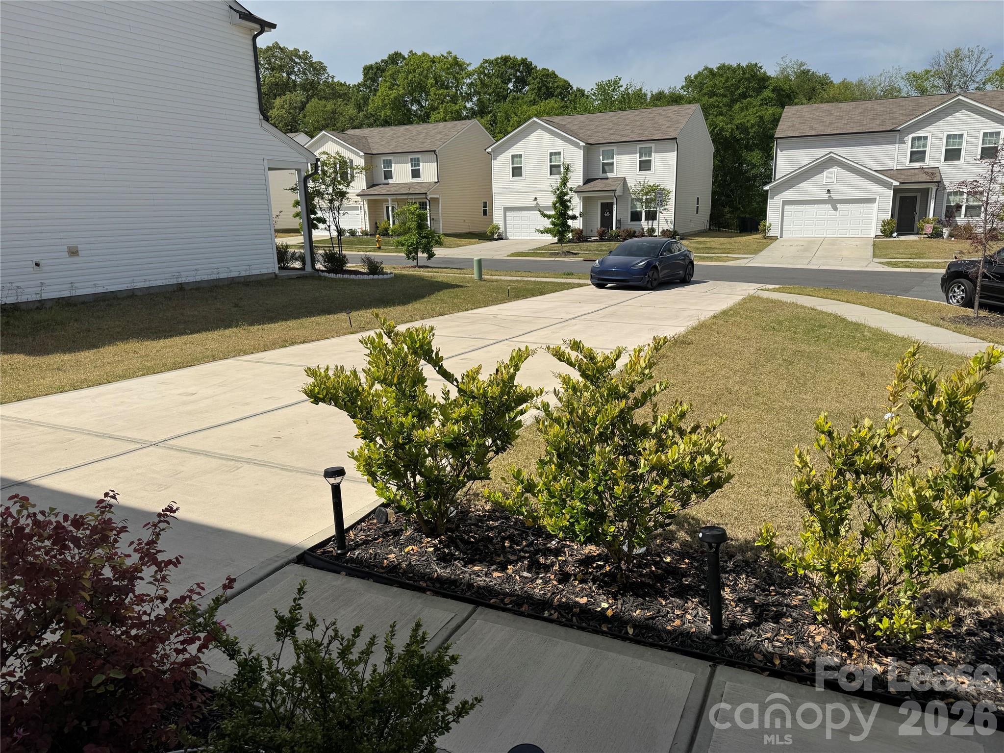 1266 Nesters Store Place Southwest Concord, NC 28027 - Photo 4 of 30 a front view of a house with garden