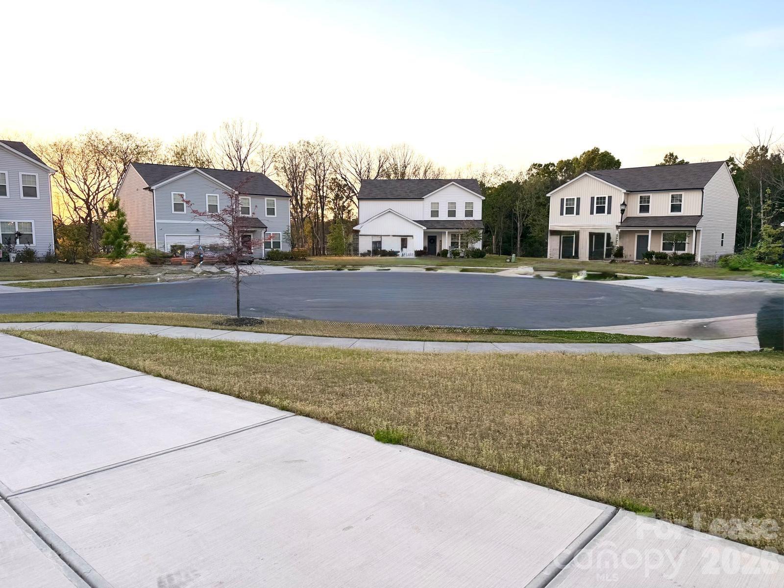 1266 Nesters Store Place Southwest Concord, NC 28027 - Photo 5 of 30 a view of houses with an outdoor space and lakeside