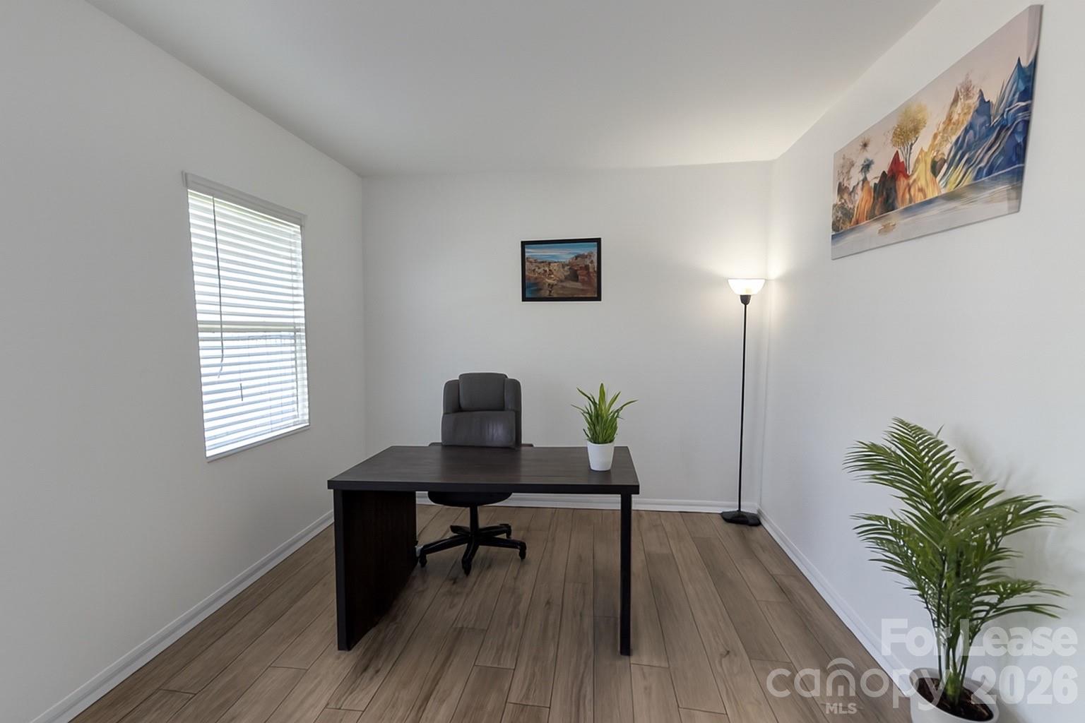 1266 Nesters Store Place Southwest Concord, NC 28027 - Photo 6 of 30 a view of a workspace with furniture and a window