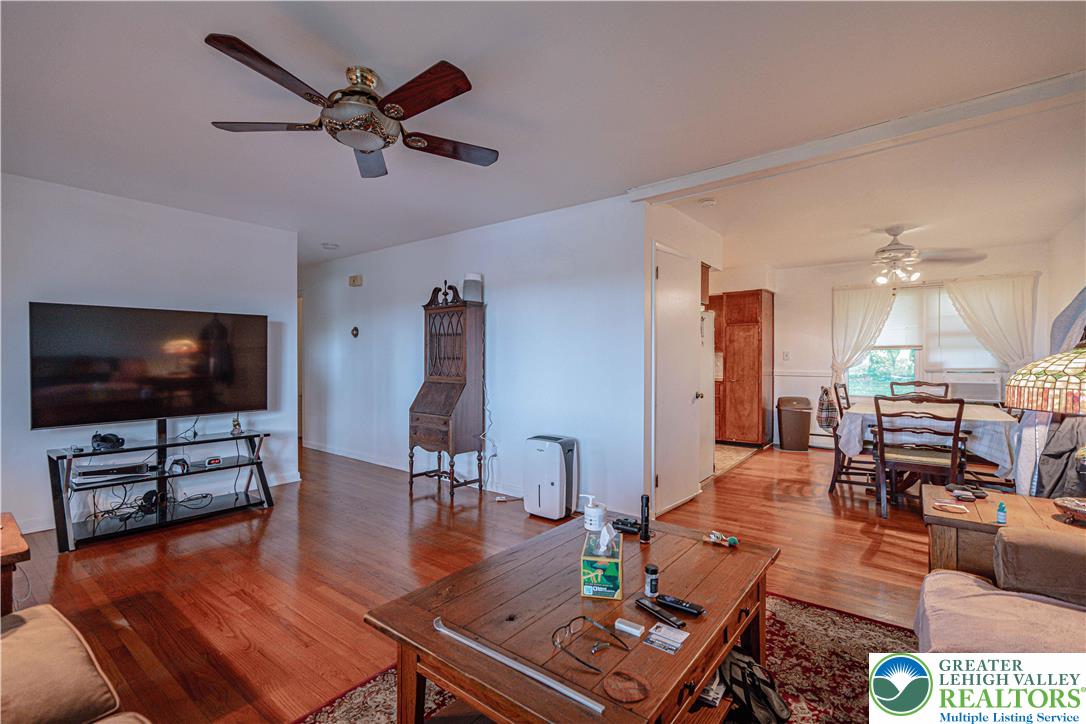 7562 Quarry Road Macungie, PA 18062 - Photo 11 of 35 a living room with furniture and a flat screen tv