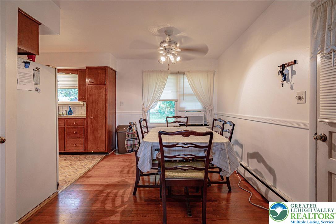 7562 Quarry Road Macungie, PA 18062 - Photo 12 of 35 a view of a dining room with furniture window and wooden floor