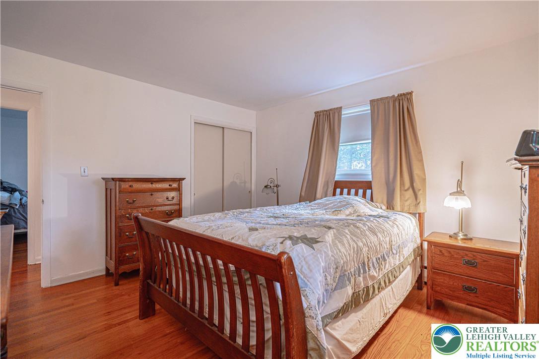 7562 Quarry Road Macungie, PA 18062 - Photo 19 of 35 a bedroom with a bed and a dresser