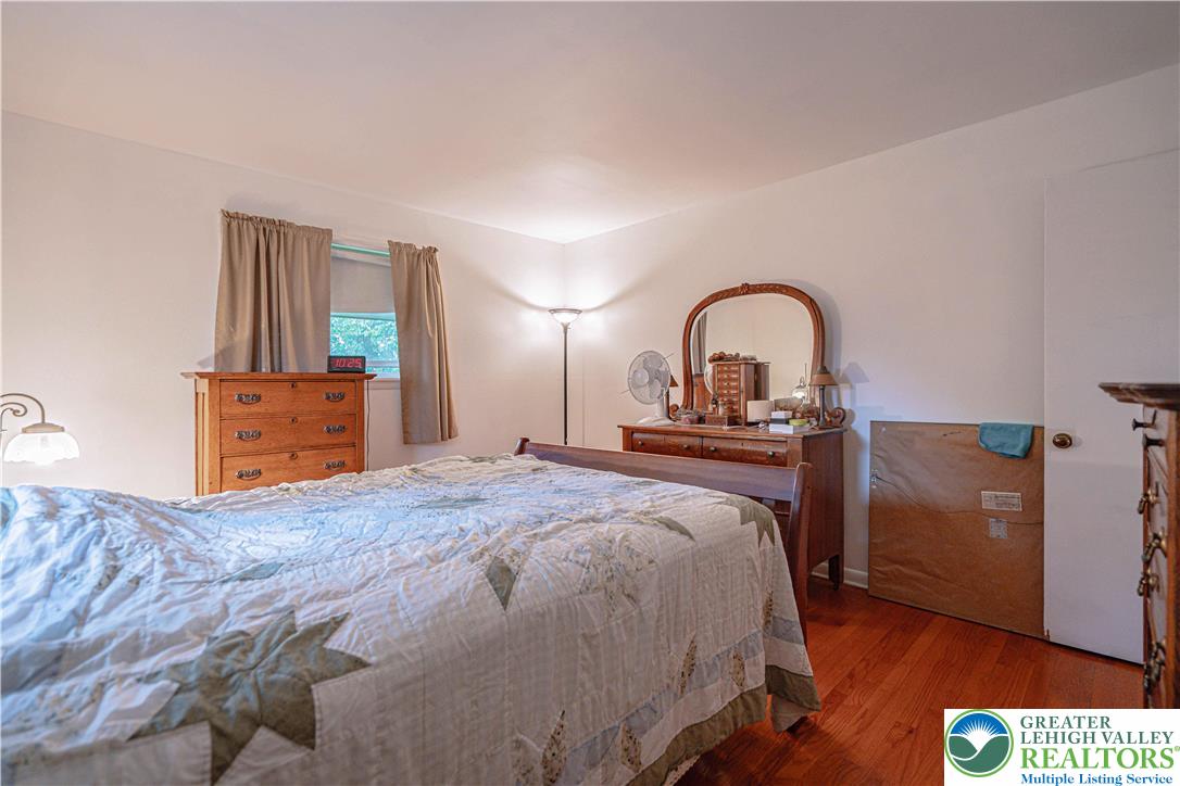 7562 Quarry Road Macungie, PA 18062 - Photo 20 of 35 a bedroom with a bed and a dresser