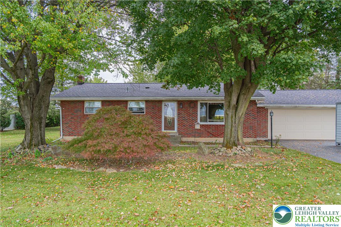 7562 Quarry Road Macungie, PA 18062 - Photo 2 of 35 a view of a house with a yard