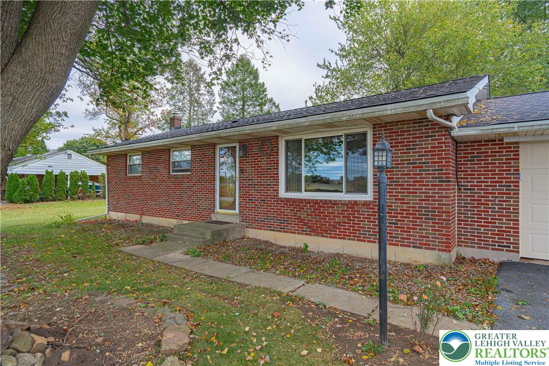 7562 Quarry Road Macungie, PA 18062 - Photo 5 of 35 a front view of a house with garden
