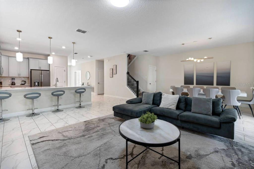 4541 Target Boulevard Kissimmee, FL 34746 - Photo 16 of 33 a living room with furniture and a view of kitchen