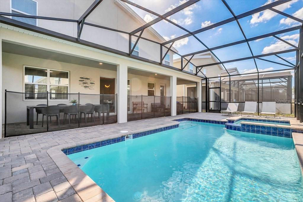 4541 Target Boulevard Kissimmee, FL 34746 - Photo 3 of 33 a swimming pool with outdoor seating