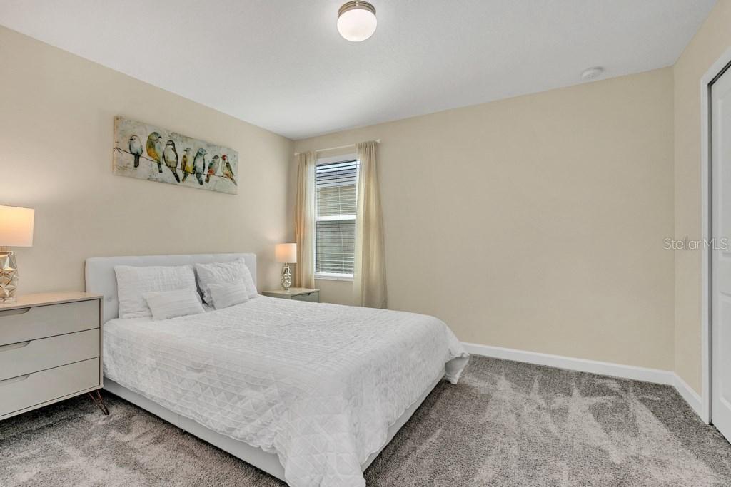 4541 Target Boulevard Kissimmee, FL 34746 - Photo 31 of 33 a bedroom with a bed and a window