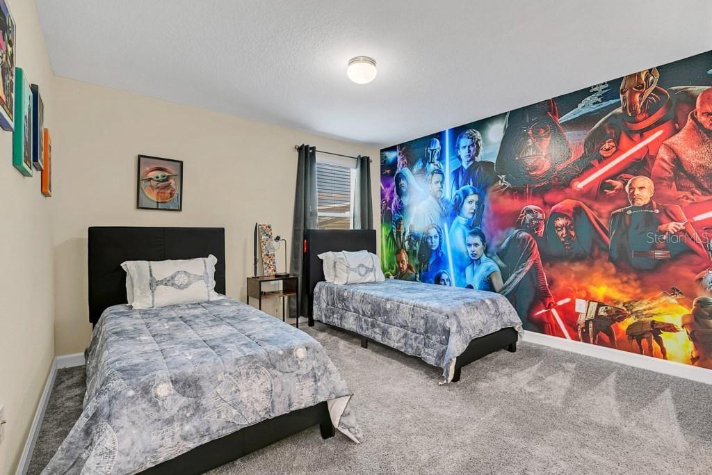 4541 Target Boulevard Kissimmee, FL 34746 - Photo 6 of 33 a bedroom with two beds and painting on the wall