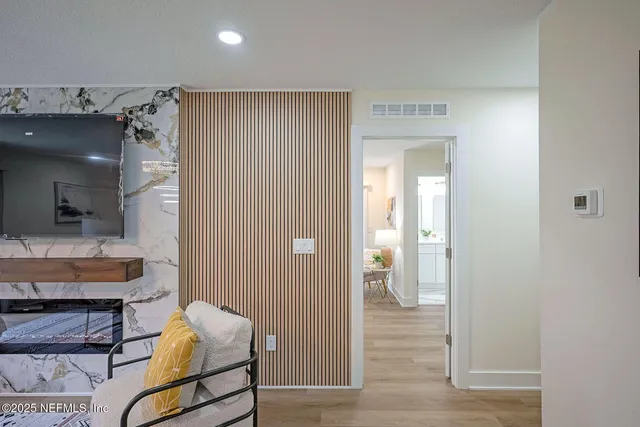 a living room with furniture and a window