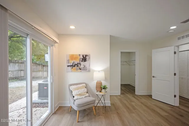 a living room with furniture and a window