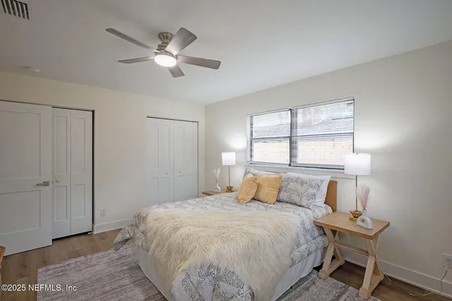 a bedroom with a bed and a mirror