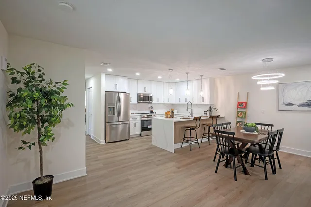 a kitchen with furniture and counter space