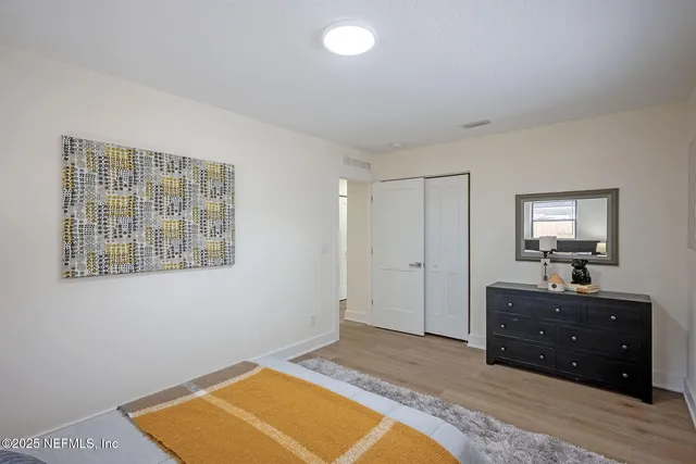 a bathroom with a sink vanity and mirror