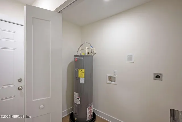 a front view of house with yard and trees