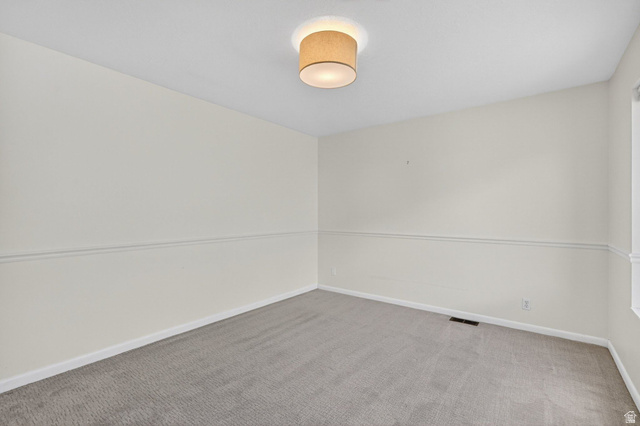 380 Luzern Road Midway, UT 84049 - Photo 32 of 74 Neutral-toned walls with a white chair rail molding create a clean aesthetic