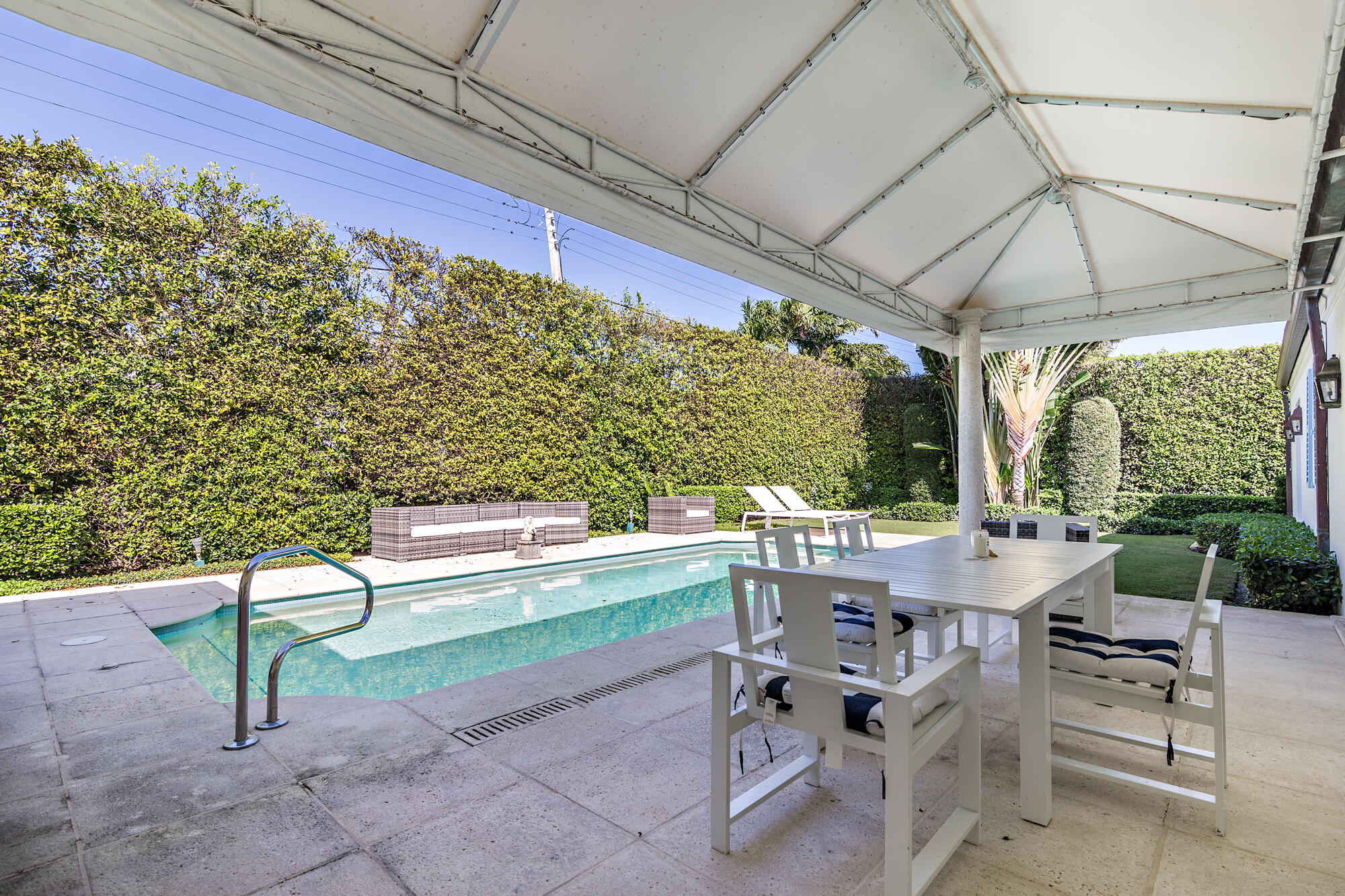 273 List Road Palm Beach, FL 33480 - Photo 17 of 26 a outdoor view with a sitting space