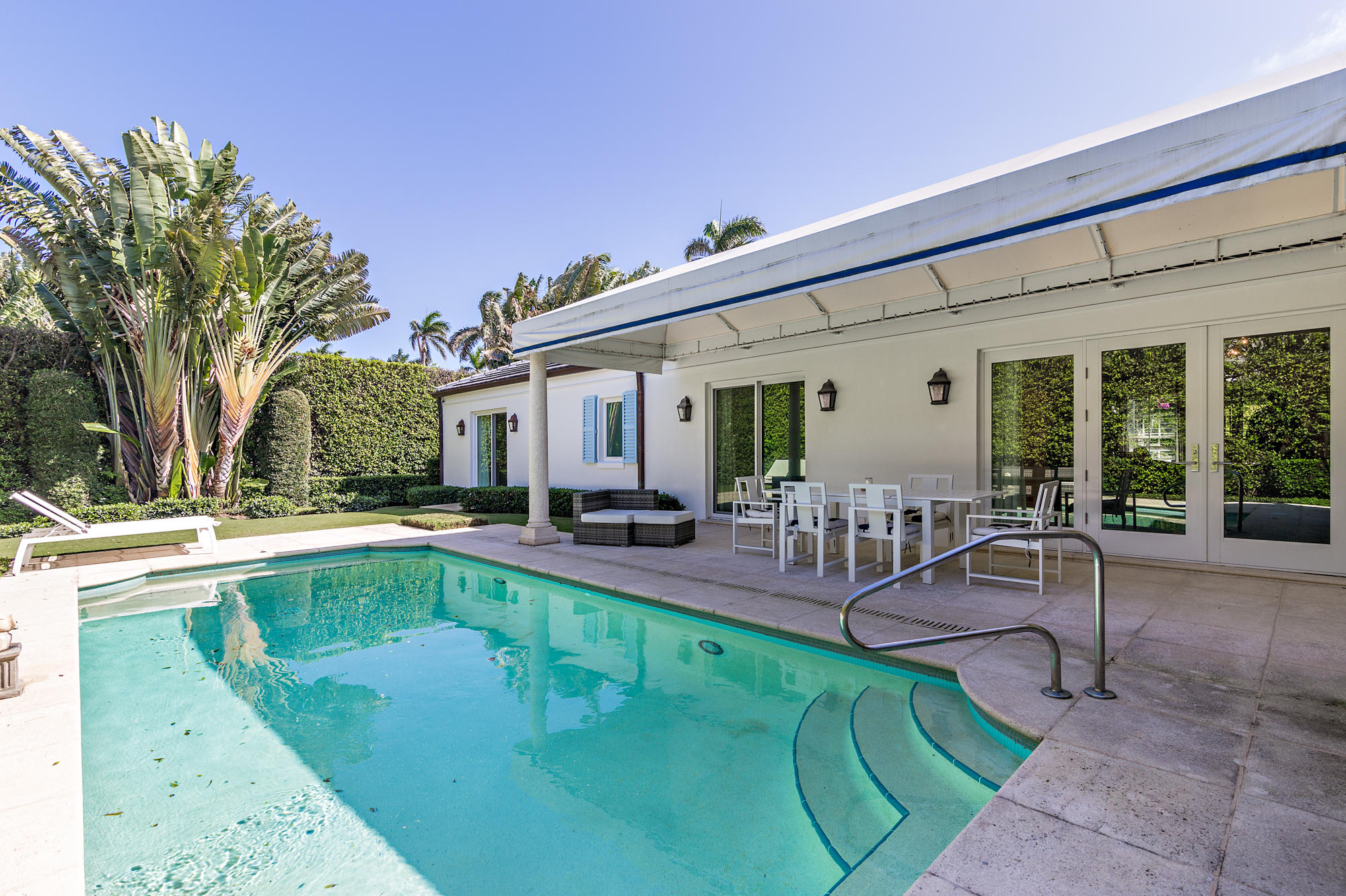 273 List Road Palm Beach, FL 33480 - Photo 19 of 26 a view of a house with swimming pool and sitting area
