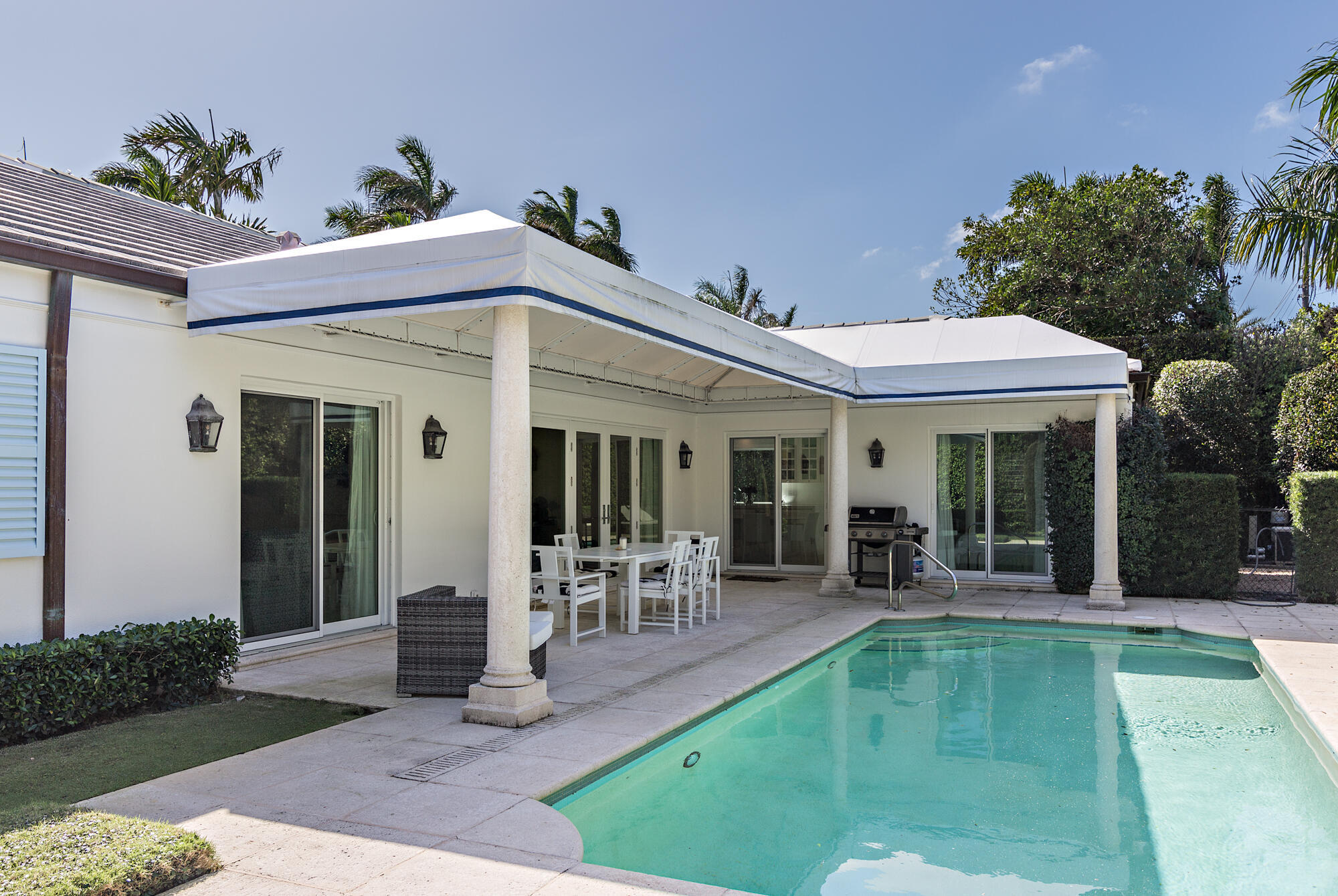 273 List Road Palm Beach, FL 33480 - Photo 20 of 26 a front view of a house with garden and porch