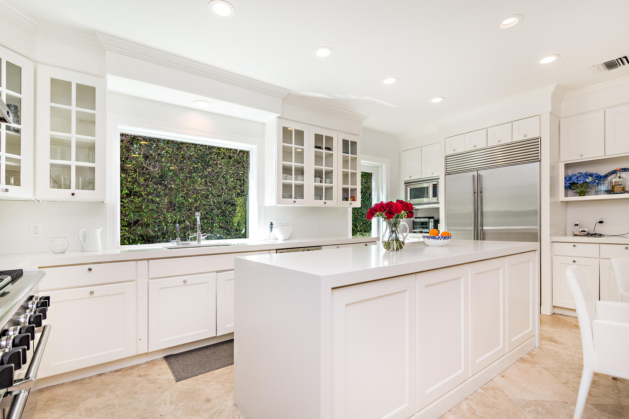 273 List Road Palm Beach, FL 33480 - Photo 8 of 26 a kitchen with stainless steel appliances granite countertop a sink and a refrigerator
