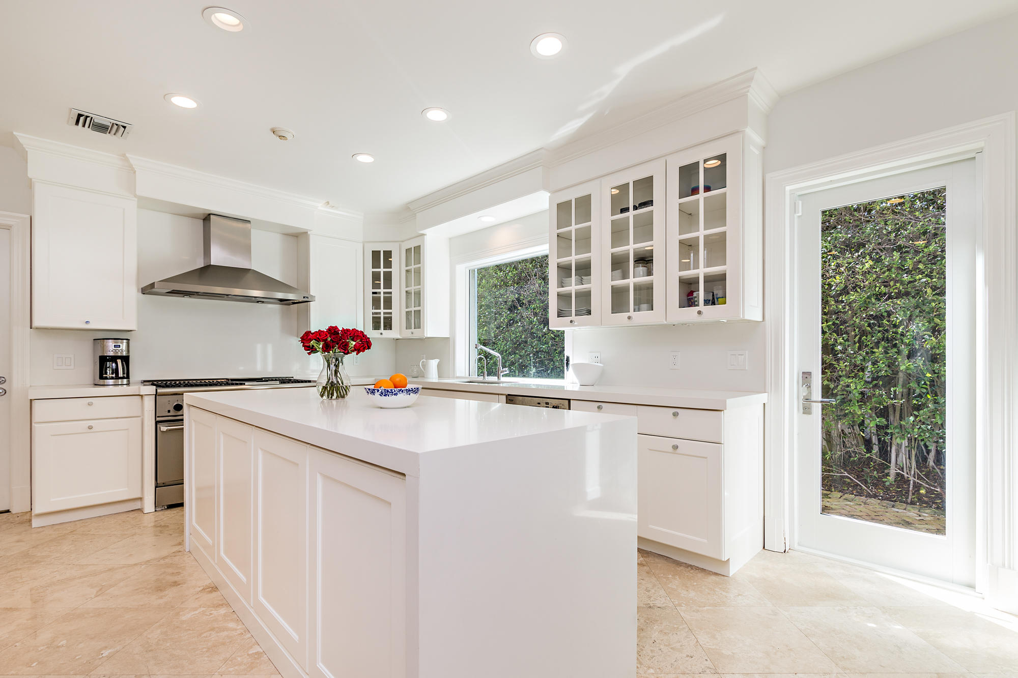 273 List Road Palm Beach, FL 33480 - Photo 9 of 26 a kitchen with kitchen island a stove a sink and a refrigerator