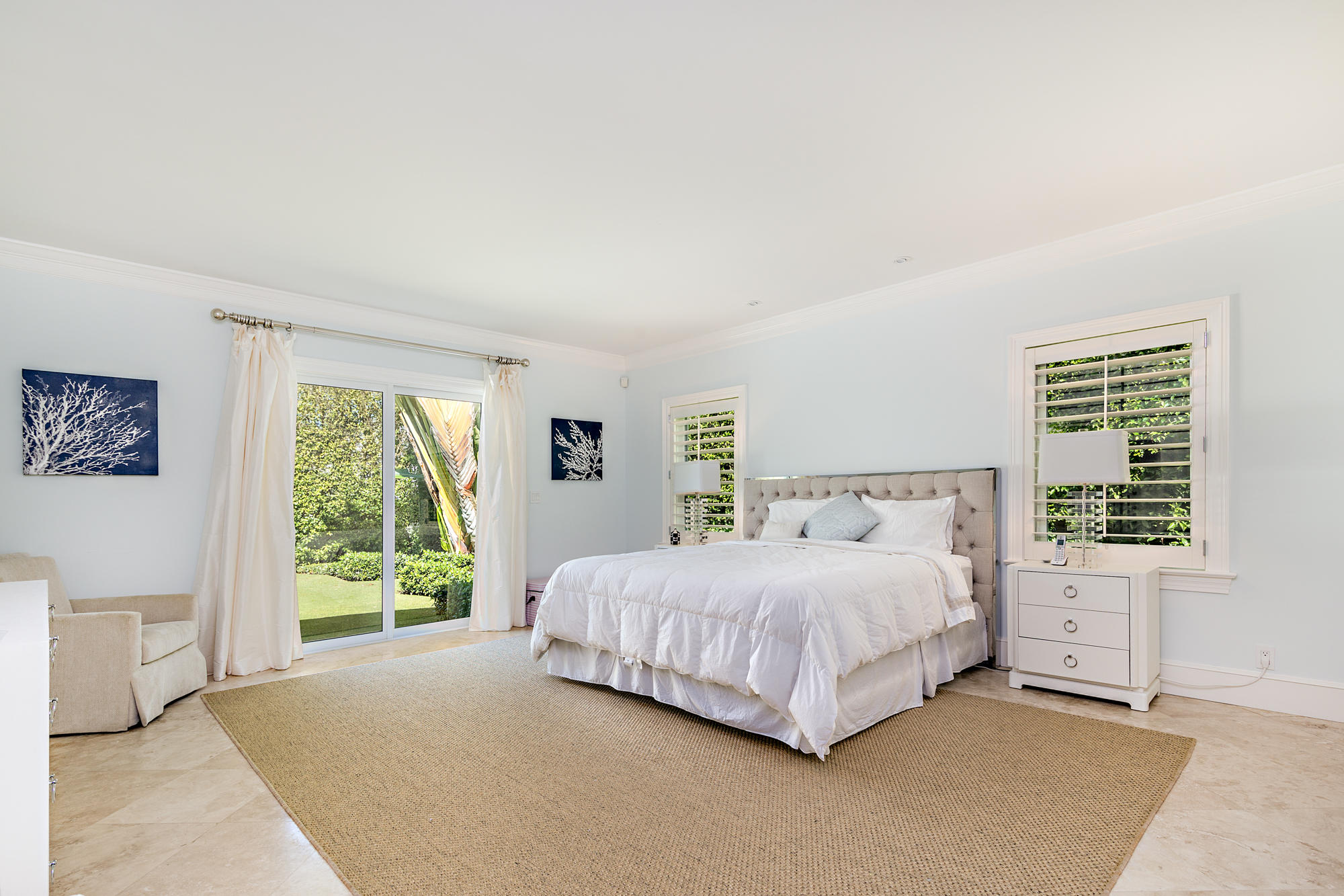 273 List Road Palm Beach, FL 33480 - Photo 10 of 26 a bedroom with a large bed and a window