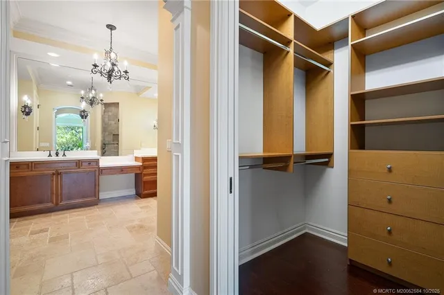 a view of a bathroom with a tub shower a mirror and a sink