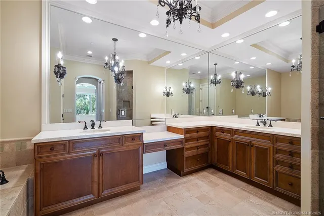 a bathroom with a double vanity sink shower and a mirror