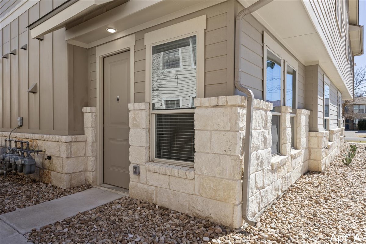 2225 Katy Lane, Unit B Georgetown, TX 78626 - Photo 3 of 22 Property entrance featuring stone siding and covered porch