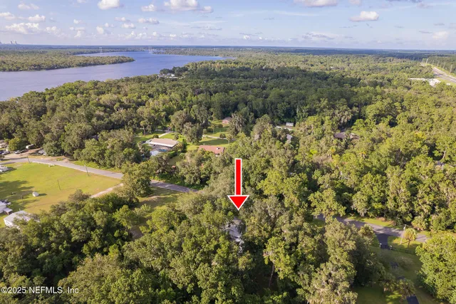 a view of a house with a yard patio and swimming pool