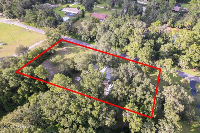 a swimming pool with outdoor seating and yard