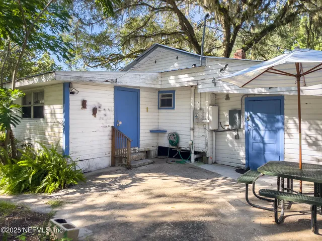 a bathroom with a sink a vanity and a large mirror