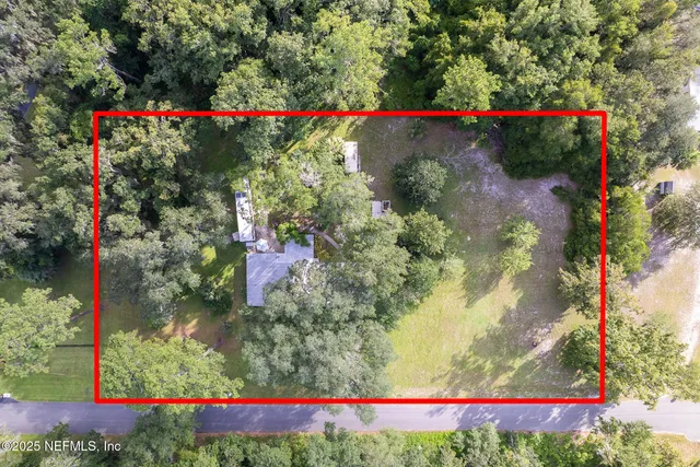 a view of a swimming pool with an outdoor seating and a yard