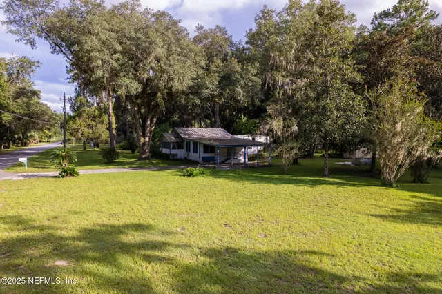 a view of an empty room with a large window