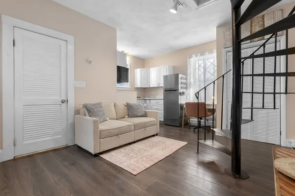 a living room with furniture and a table