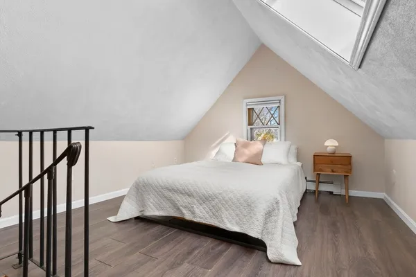 a bedroom with a bed and a desk