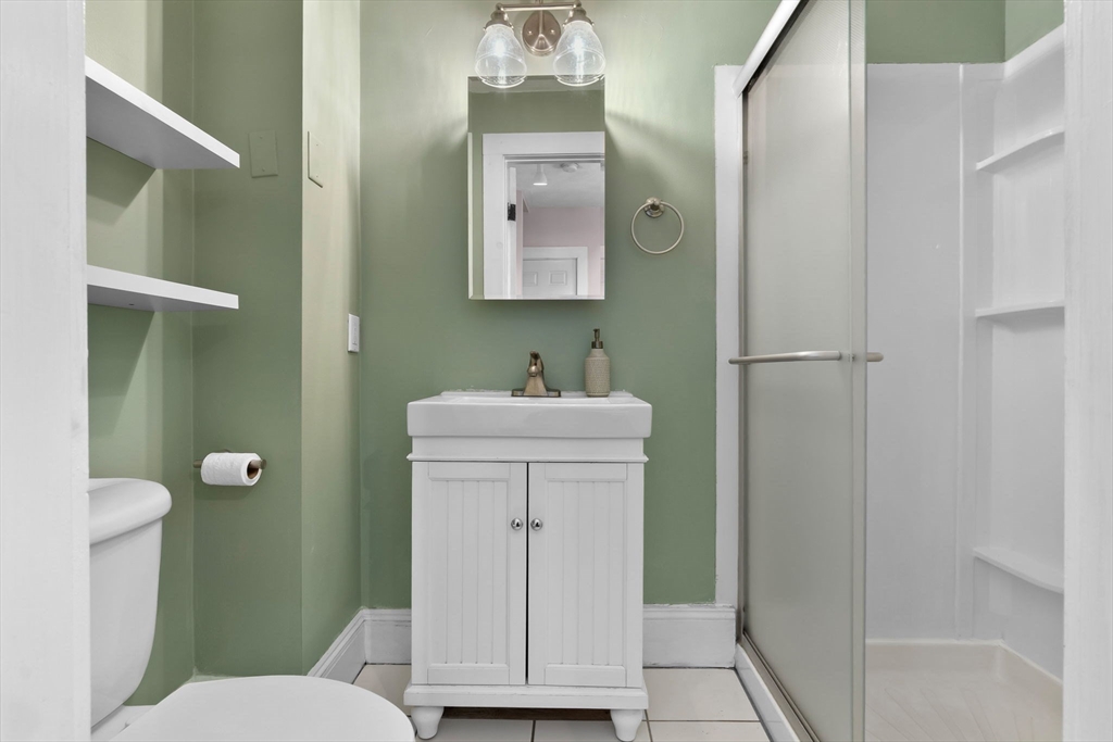 28 Columbus Avenue, Unit 4 Beverly, MA 01915 - Photo 18 of 25 a bathroom with a sink a toilet and shower