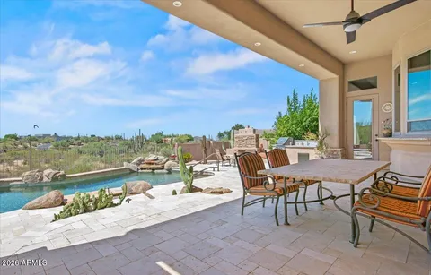 a view of a terrace with furniture