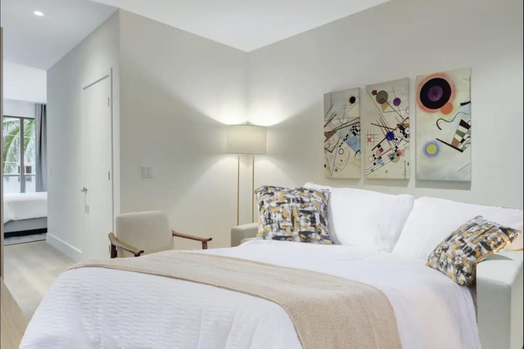 229 Southwest 9th Street, Unit 201 Miami, FL 33130 - Photo 11 of 21 a bedroom with a bed and a window