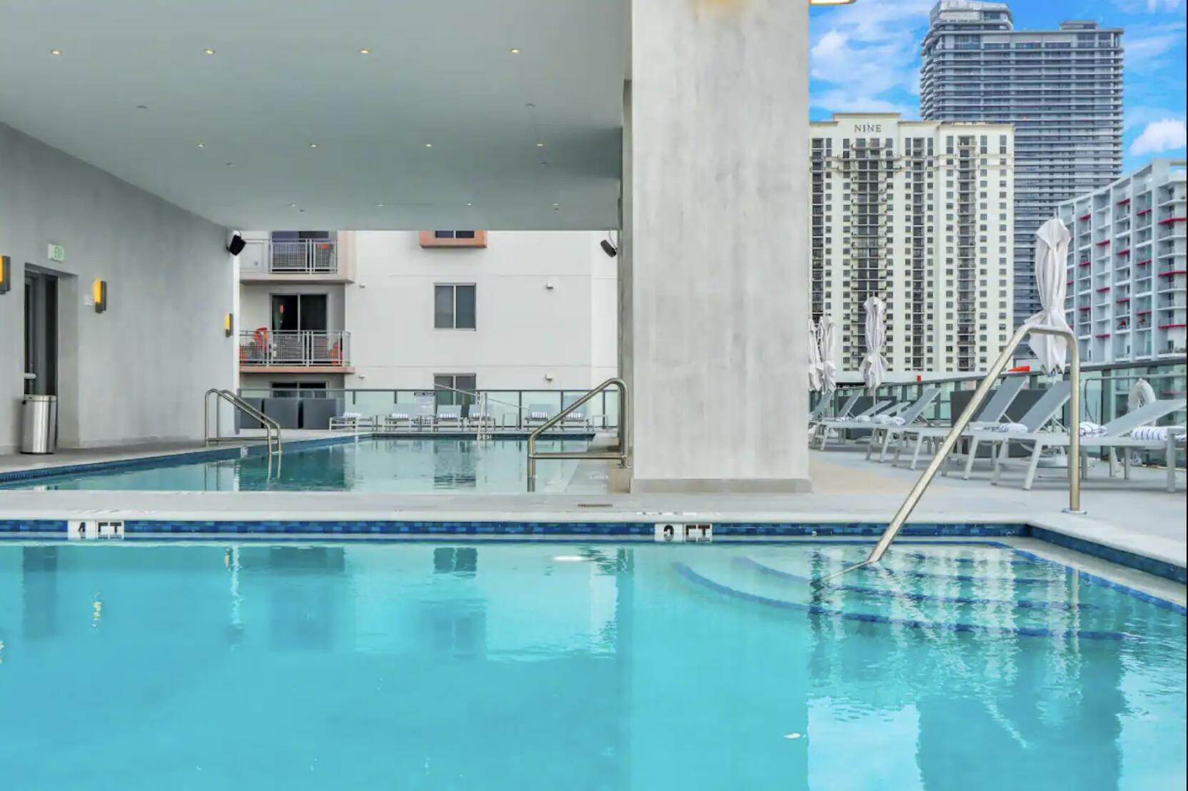 229 Southwest 9th Street, Unit 201 Miami, FL 33130 - Photo 16 of 21 a view of pool exterior with dining room