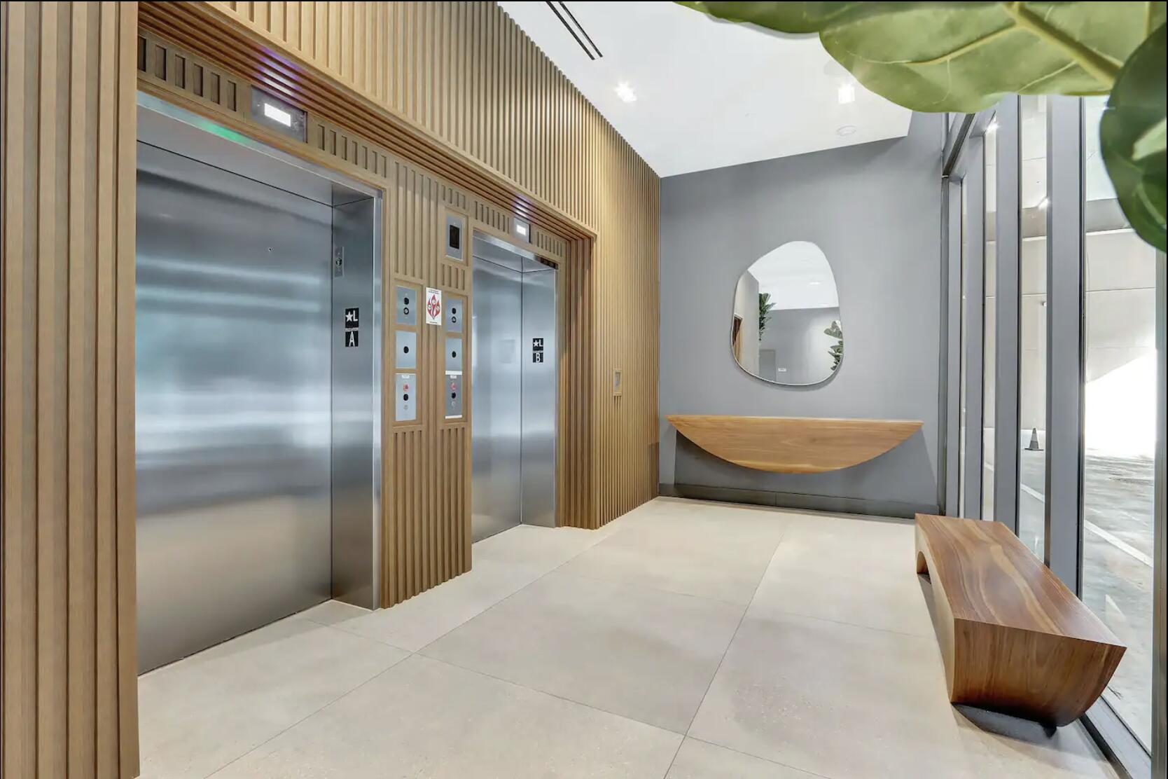 229 Southwest 9th Street, Unit 201 Miami, FL 33130 - Photo 18 of 21 a bedroom with a bed and a potted plant