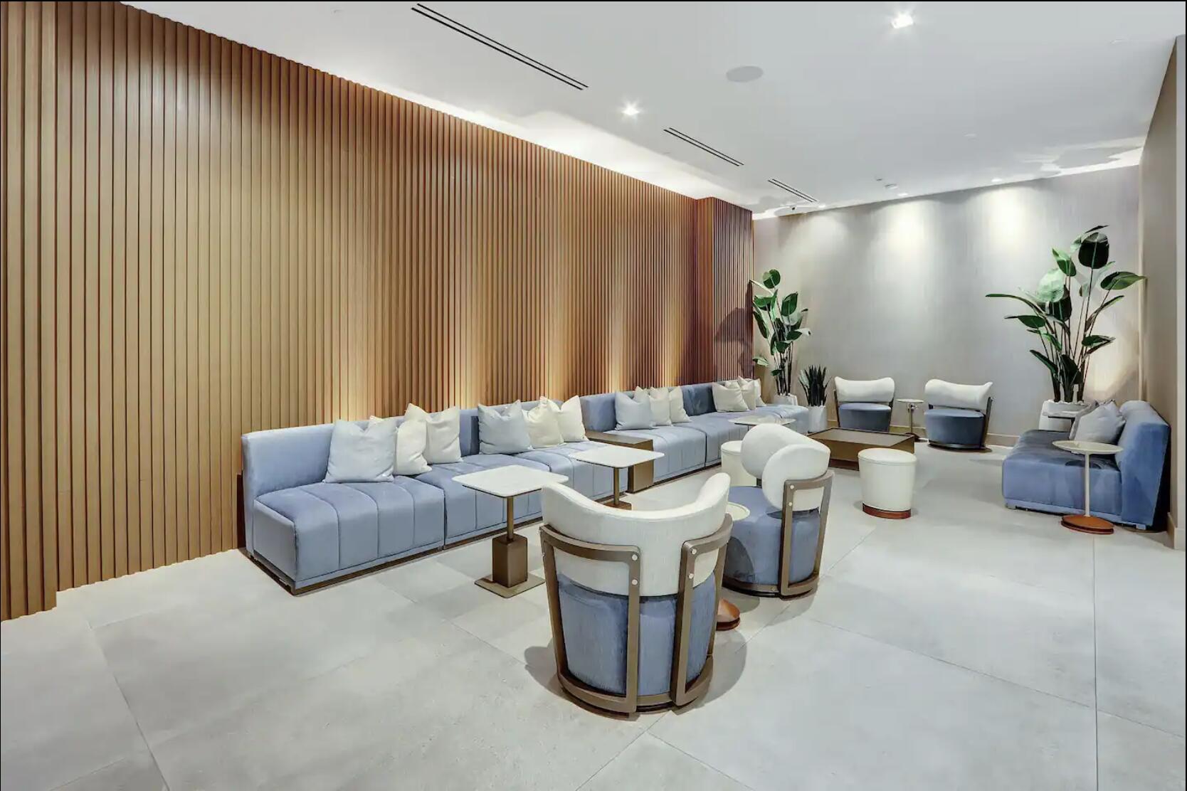 229 Southwest 9th Street, Unit 201 Miami, FL 33130 - Photo 19 of 21 a living room with furniture a lamp and a potted plant