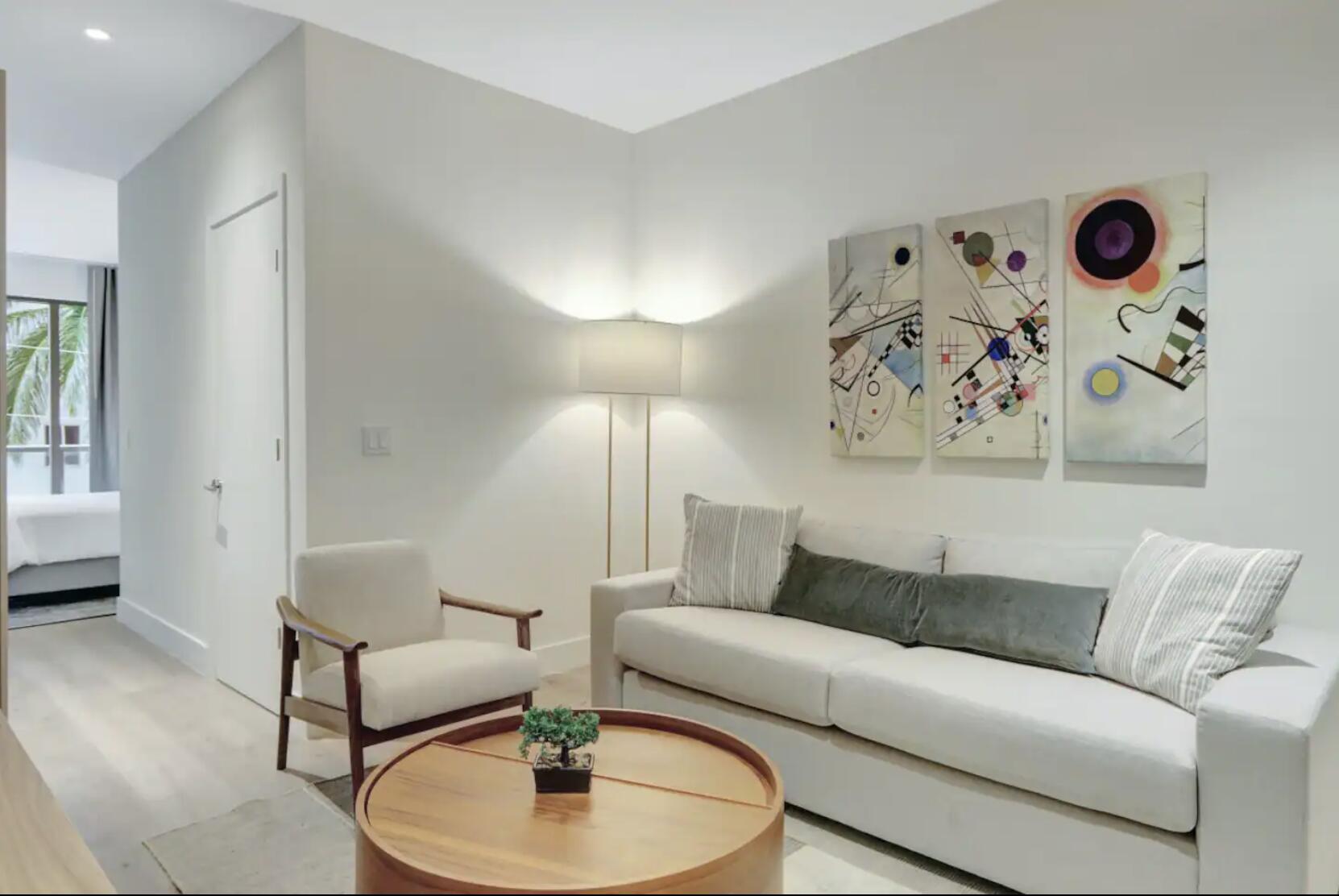 229 Southwest 9th Street, Unit 201 Miami, FL 33130 - Photo 2 of 21 a living room with furniture and a wooden floor