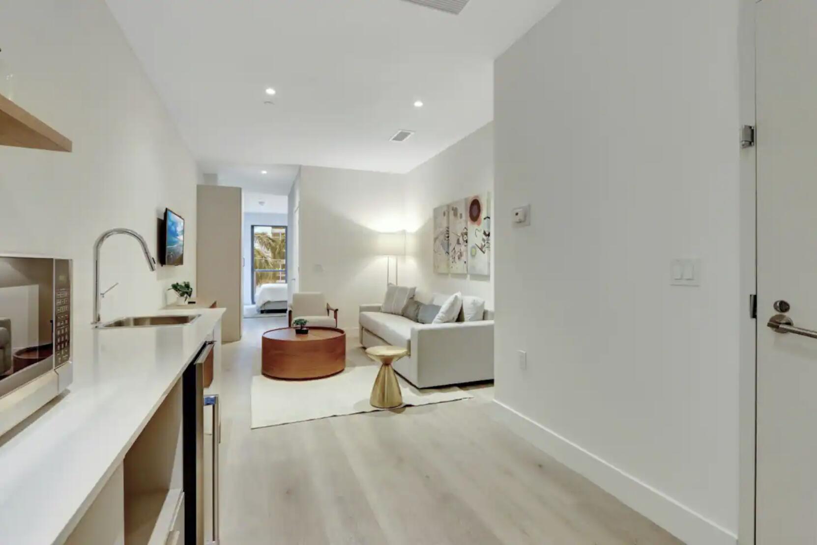 229 Southwest 9th Street, Unit 201 Miami, FL 33130 - Photo 4 of 21 a living room with furniture