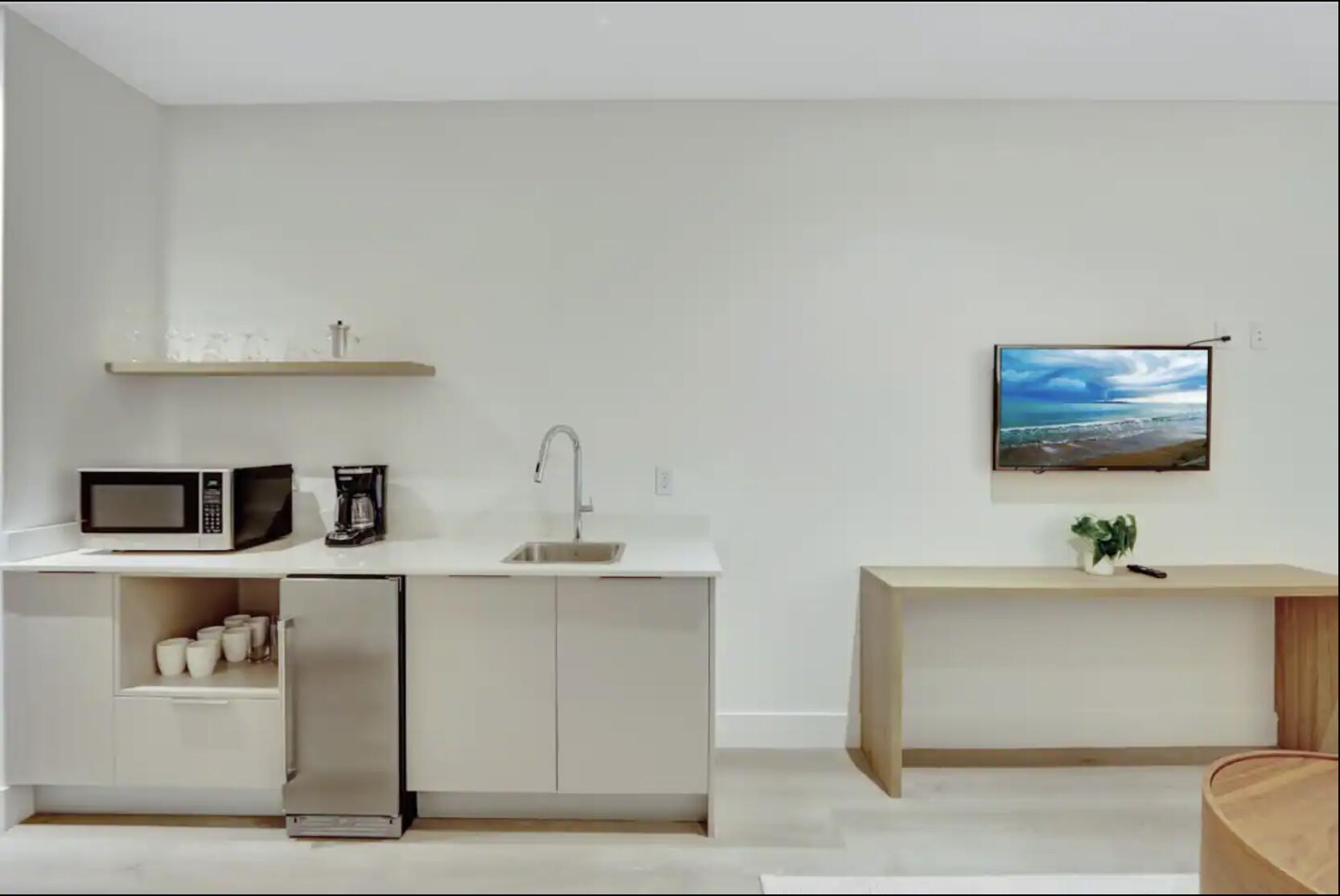 229 Southwest 9th Street, Unit 201 Miami, FL 33130 - Photo 6 of 21 a hallway with cabinets and window
