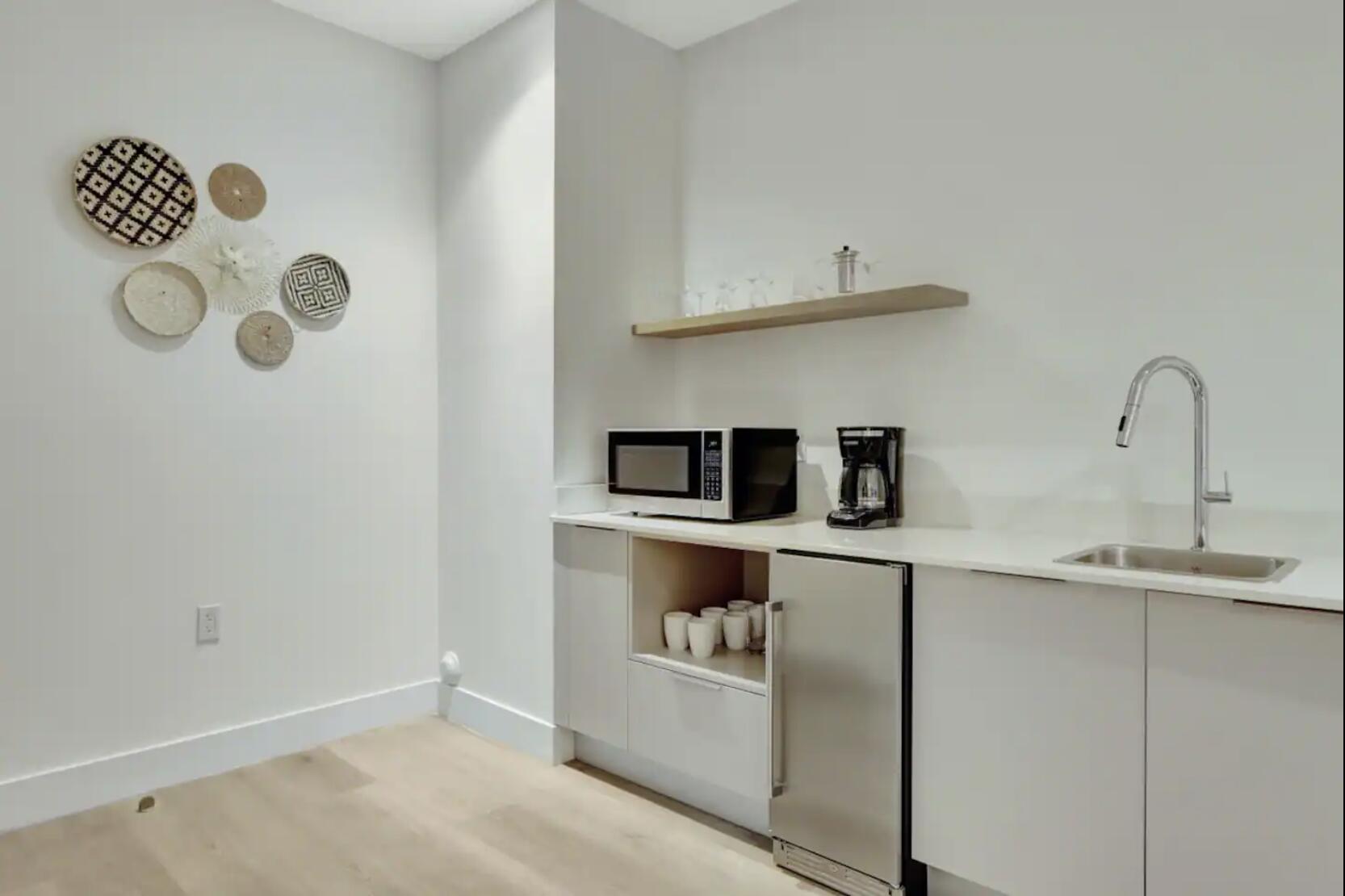 229 Southwest 9th Street, Unit 201 Miami, FL 33130 - Photo 7 of 21 a kitchen with cabinets and window