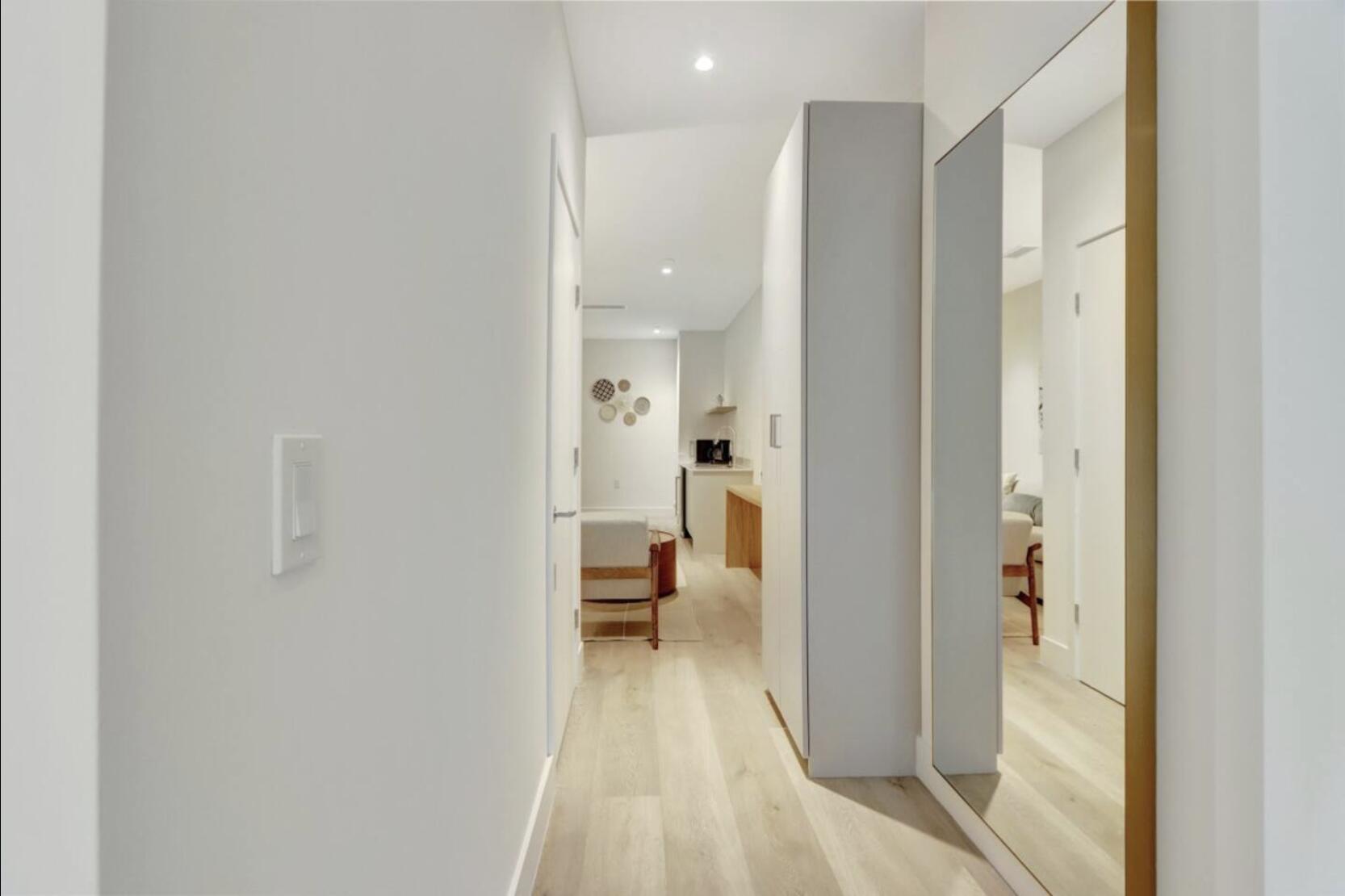 229 Southwest 9th Street, Unit 201 Miami, FL 33130 - Photo 8 of 21 a view of a walk in closet with living room