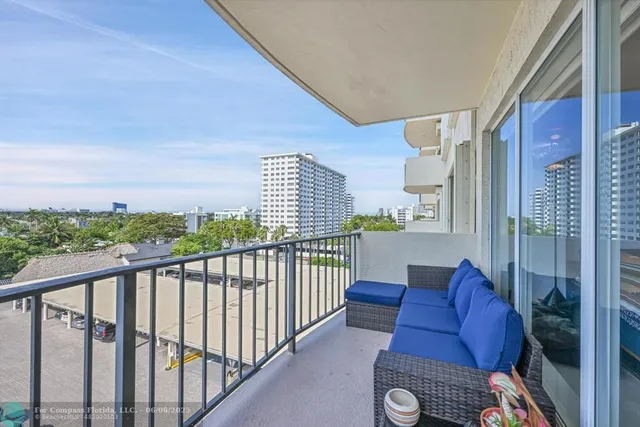 a view of balcony with furniture