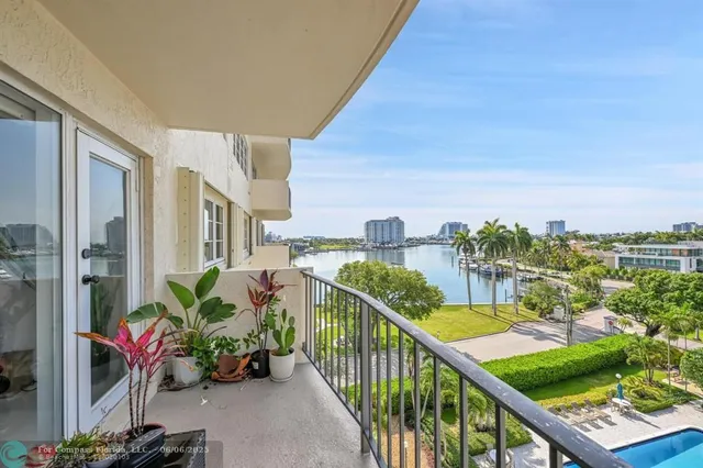 a view of a balcony with an outdoor seating