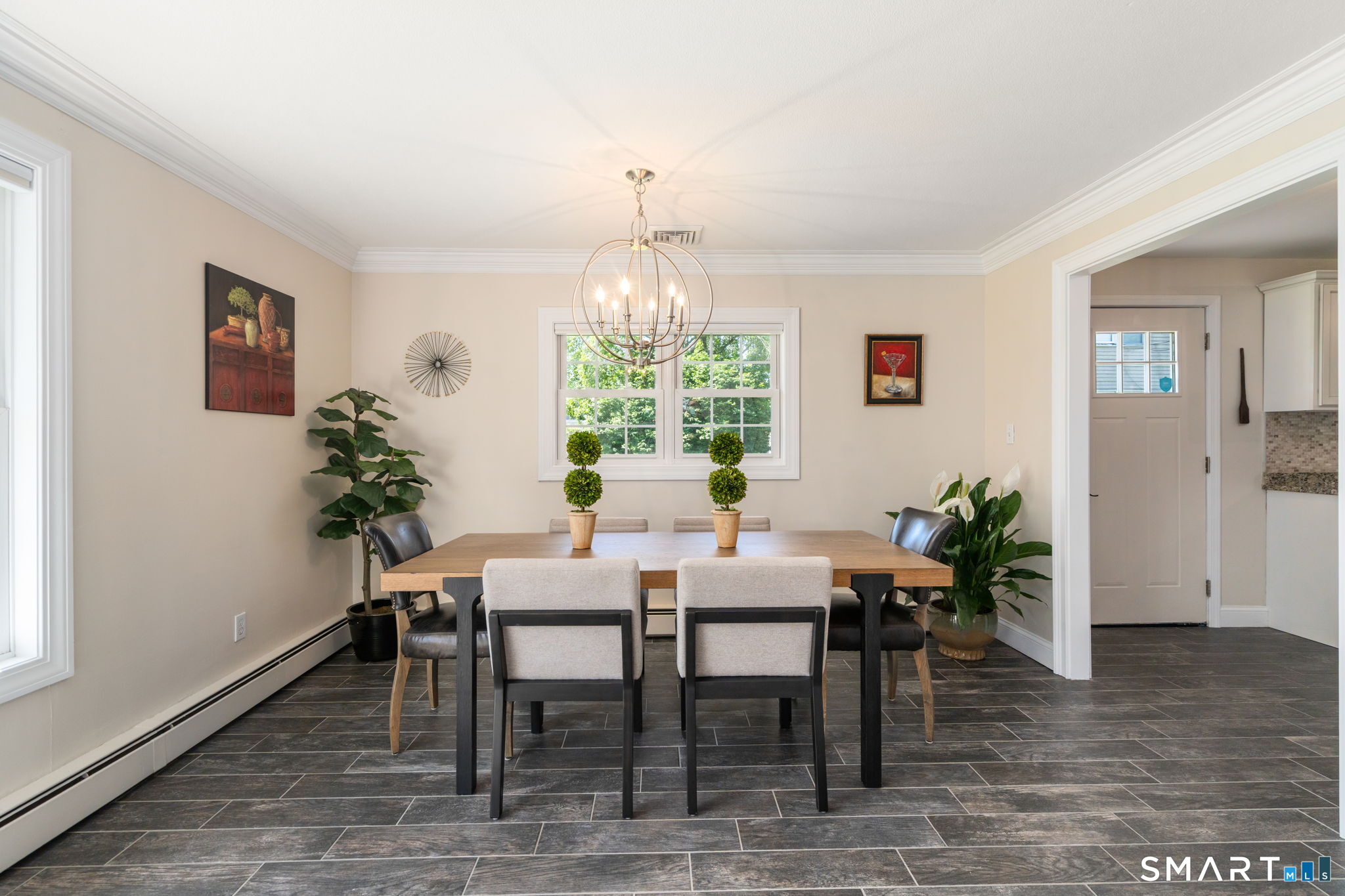31 Cowan Street Suffield, CT 06078 - Photo 11 of 29 a view of a dining room with furniture window and wooden floor